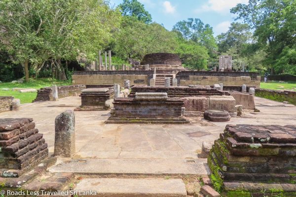 Hatthikucchi Viharaya - ruined ancient temple complex framed by rock boulders By Arundathie Abeysinghe