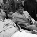 Joe Frazier talking to Dinesh Palipana in 2010 not long after a spinal cord injury changed his life forever