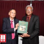 Prof G L Peiris (Chief Guest) and Mevan Pieris, author holding the book - elanka