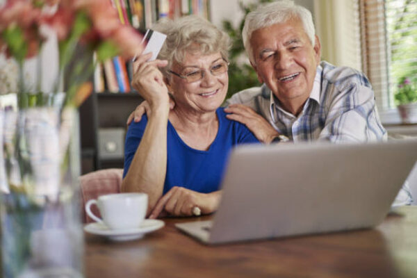 Senior couple doing shopping online