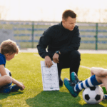 How can a Change manager explain what ‘Coaching’ is? What are the key elements of coaching?