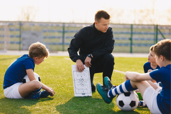 How can a Change manager explain what ‘Coaching’ is? What are the key elements of coaching?