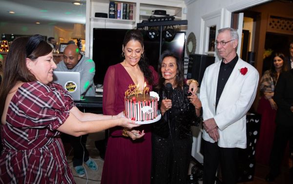Megan Ortega, Iswari and Rene watch Evelyn cut her birthday cake, it was Evelyn's birthday too!